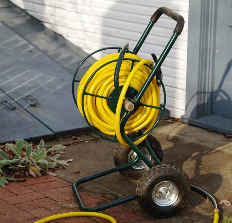 Portable Garden Hose Reel Cart Stock Photo