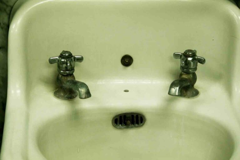 Old Vintage Sink Stock Photo with Hot and Cold Faucet