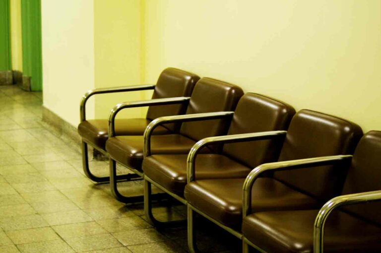 Waiting Room Chairs in Hallway, Vintage Institution, Hospital Stock Photo