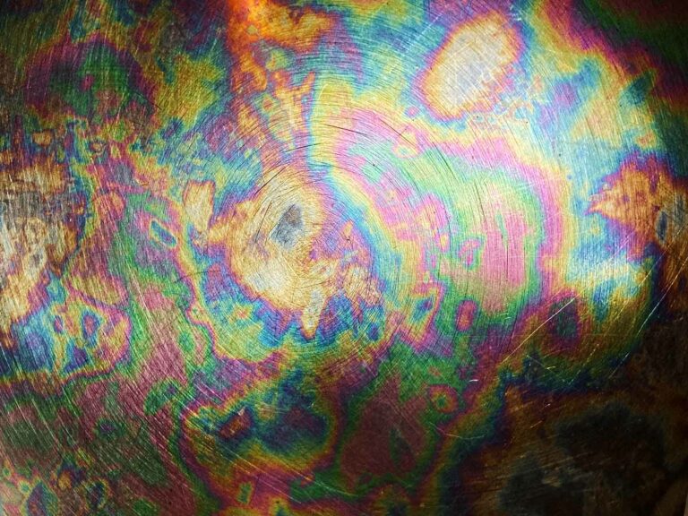 Scratched Metal With Rainbow Swirls Texture